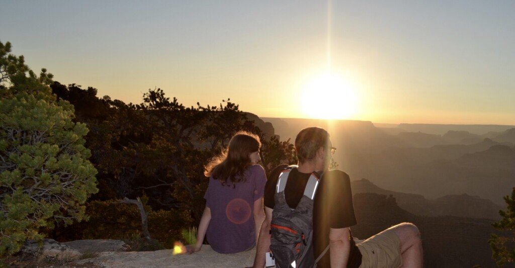 Family looking out at Grand Canyon Sunset