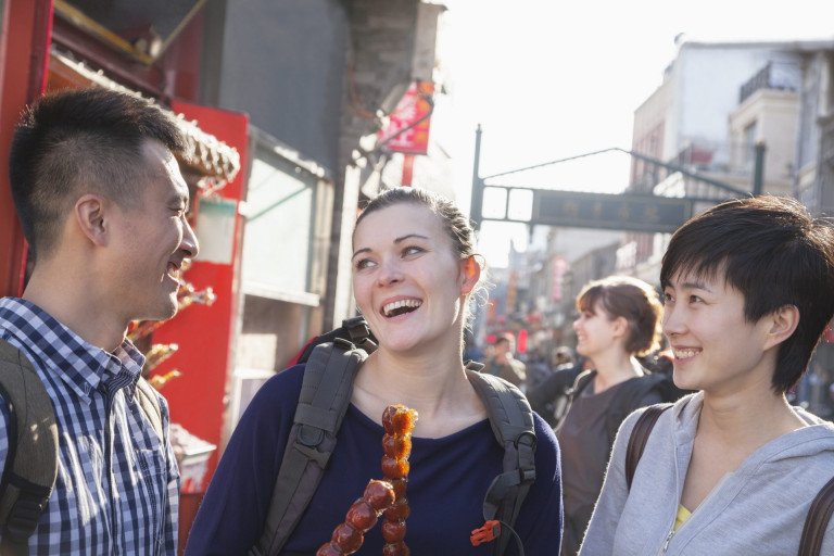 Three young people with candied haw in China